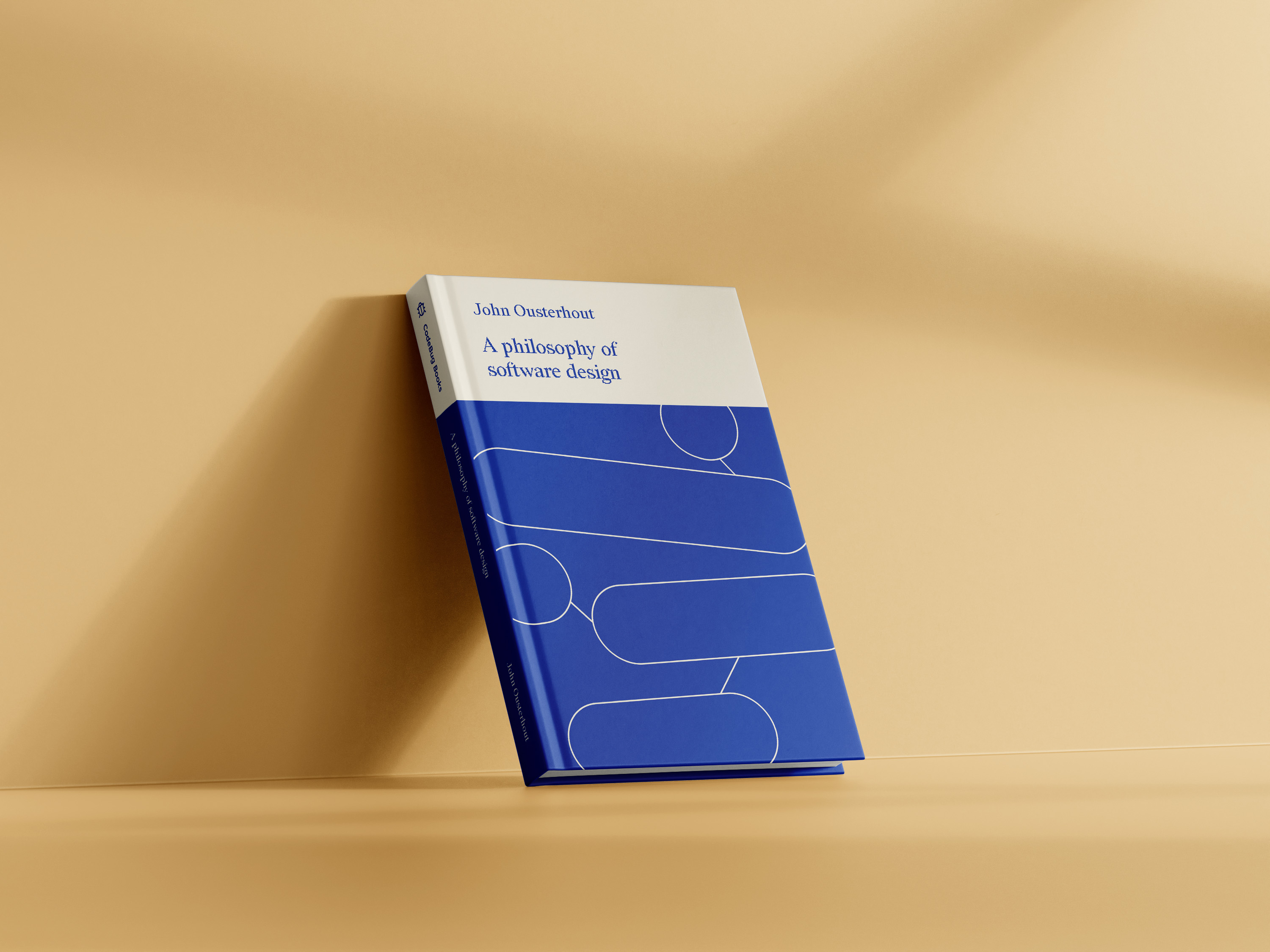 Photographic mockup of 'A Philosophy of Software Design', open and upside down, with a yellow background